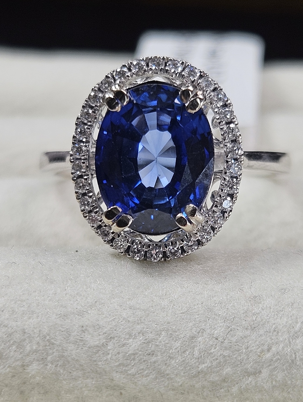 14k White Gold 3.65ct. Oval Sapphire 0.15ct Diamond Halo Ring (3.80Ctw)